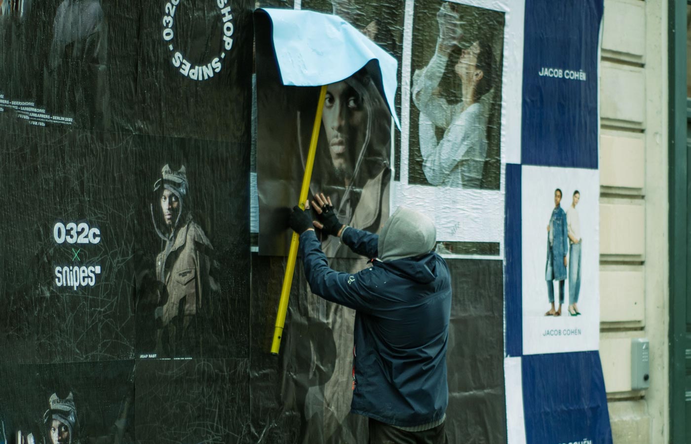Wheatpaste poster installation by street teams in Philadelphia